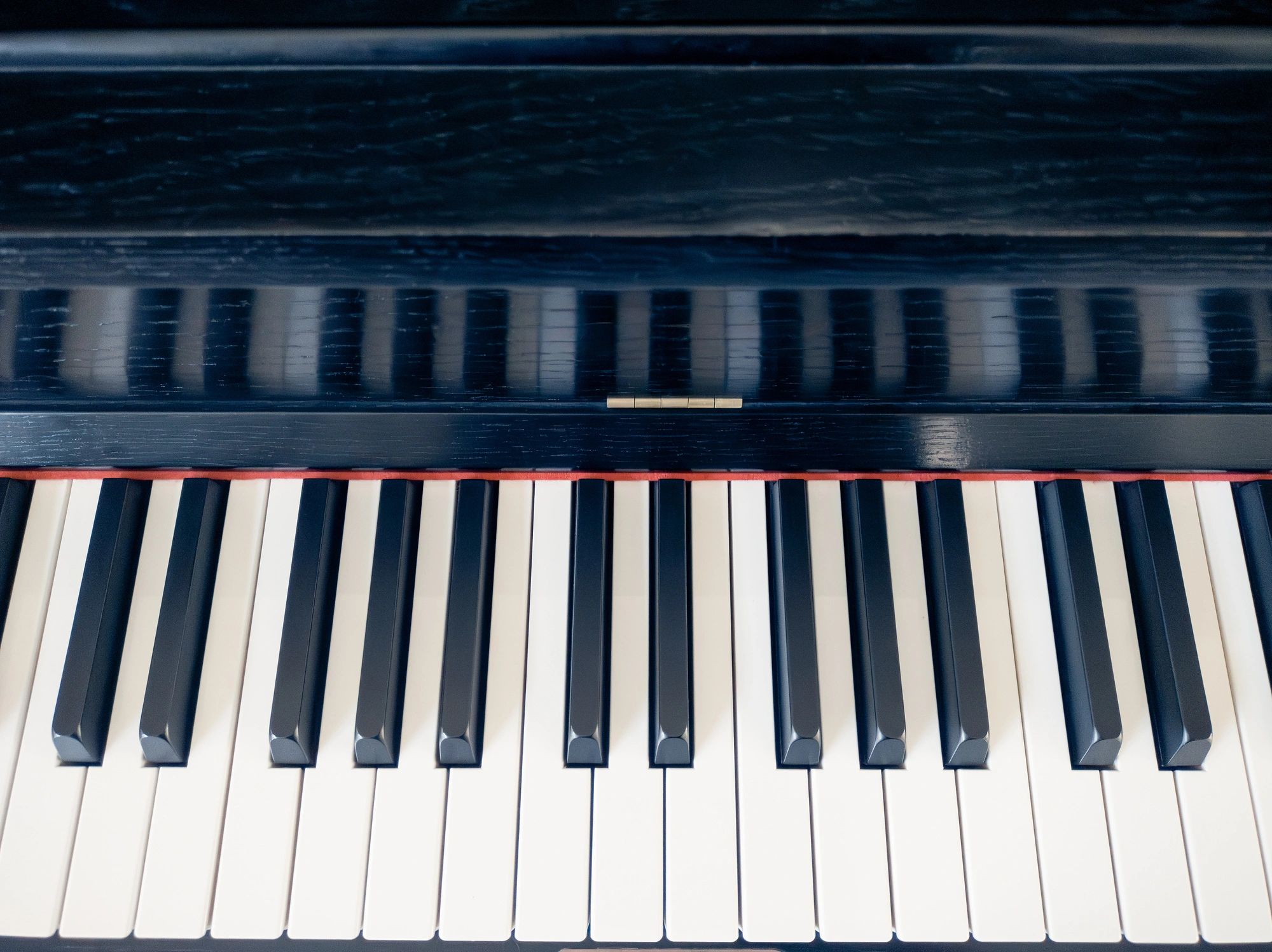 Black upright acoustic piano keys